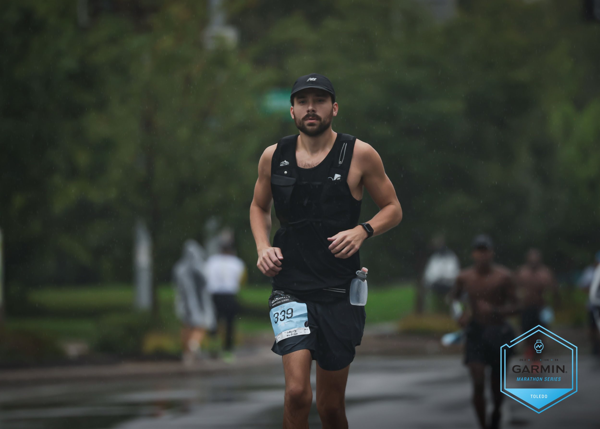 Greg running during a marathon in the rain